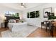 Bright bedroom with large windows, modern decor, and hardwood floors at 3061 S Marion St, Englewood, CO 80113