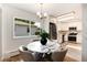 Eat-in kitchen features white marble table with seating for four and stainless steel appliances at 3061 S Marion St, Englewood, CO 80113