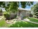 Charming single-story home with a well-manicured lawn and mature trees in a desirable neighborhood at 3061 S Marion St, Englewood, CO 80113