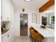 Bright eat-in kitchen featuring quartz countertops, white cabinetry and modern finishes at 3061 S Marion St, Englewood, CO 80113