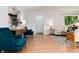 Bright living room with hardwood floors, modern furniture, and large windows offering plenty of natural light at 3061 S Marion St, Englewood, CO 80113