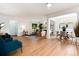 Spacious living and dining area with hardwood floors, ample natural light, and contemporary furnishings at 3061 S Marion St, Englewood, CO 80113