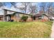 Charming single-story brick home featuring a well-manicured lawn and inviting curb appeal on a sunny day at 2259 Meade St, Denver, CO 80211