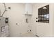 Clean laundry room features a water heater, utility sink, and access to the outside at 2259 Meade St, Denver, CO 80211
