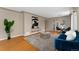 Comfortable living room with hardwood floors, stylish furnishings, and access to the dining area at 2259 Meade St, Denver, CO 80211