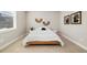 Cozy bedroom with a minimalist aesthetic, light wood accents, and bright natural light at 6111 W 28Th Ct, Wheat Ridge, CO 80214