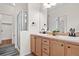 Double vanity bathroom with shower and updated fixtures at 15945 E Geddes Dr # 54, Aurora, CO 80016