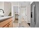 Convenient bathroom with toilet, sink, and access to storage at 15945 E Geddes Dr # 54, Aurora, CO 80016