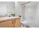 Clean bathroom with light wood cabinets and a shower/tub combo at 15945 E Geddes Dr # 54, Aurora, CO 80016