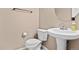 Clean and simple bathroom with pedestal sink and shower at 15945 E Geddes Dr # 54, Aurora, CO 80016