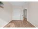 Spacious bedroom with double-door closet and wood-look flooring at 15945 E Geddes Dr # 54, Aurora, CO 80016