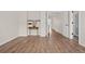 Spacious bedroom with wood-look floors and access to bathroom at 15945 E Geddes Dr # 54, Aurora, CO 80016