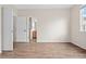 Bedroom with vinyl flooring and doorway leading to bathroom at 15945 E Geddes Dr # 54, Aurora, CO 80016