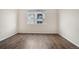 Bright bedroom with neutral walls and wood-look flooring at 15945 E Geddes Dr # 54, Aurora, CO 80016