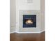 Cozy corner fireplace with tile surround at 15945 E Geddes Dr # 54, Aurora, CO 80016