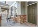 Charming front porch with seating and a welcoming entrance to the home at 15945 E Geddes Dr # 54, Aurora, CO 80016
