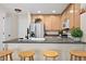 Kitchen boasts a breakfast bar with seating and modern finishes at 15945 E Geddes Dr # 54, Aurora, CO 80016
