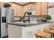 Modern kitchen with stainless steel appliances and wood cabinets at 15945 E Geddes Dr # 54, Aurora, CO 80016