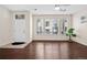 Living room with hardwood floors and large windows at 15945 E Geddes Dr # 54, Aurora, CO 80016
