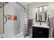 Bathroom featuring updated fixtures, a shower/tub combination, and modern vanity at 5747 S Lowell Blvd, Littleton, CO 80123