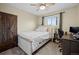 Bright bedroom with carpet flooring, a ceiling fan and ample natural light at 5747 S Lowell Blvd, Littleton, CO 80123