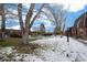 Community with mature trees, snowy yard and swimming pool at 5747 S Lowell Blvd, Littleton, CO 80123