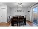 Dining room with wood floors, modern lighting, and access to the backyard at 5747 S Lowell Blvd, Littleton, CO 80123