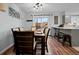 Dining room with seating for six and sliding door leading to a backyard at 5747 S Lowell Blvd, Littleton, CO 80123