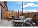 Cozy patio space with comfortable seating, outdoor lighting, and a privacy fence, perfect for relaxing and entertaining at 5747 S Lowell Blvd, Littleton, CO 80123