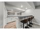 Finished basement area featuring a granite countertop bar and carpet flooring at 14632 Longhorn Dr, Mead, CO 80542