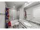 Bathroom featuring a granite vanity top and tiled shower at 14632 Longhorn Dr, Mead, CO 80542