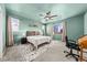 Relaxing bedroom featuring neutral decor, a ceiling fan, and natural light from large windows at 14632 Longhorn Dr, Mead, CO 80542