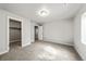 Minimalist bedroom featuring carpet floors, a walk in closet and white walls at 14632 Longhorn Dr, Mead, CO 80542