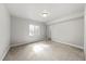 Empty bedroom with neutral carpet, baseboards, and natural light from a window at 14632 Longhorn Dr, Mead, CO 80542