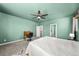 Spacious bedroom with a ceiling fan and a view of the doorway leading to the hallway at 14632 Longhorn Dr, Mead, CO 80542