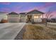 Charming single-Gathering home featuring a welcoming front porch and a spacious three-car garage at 14632 Longhorn Dr, Mead, CO 80542