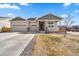 Charming single-Gathering home featuring a welcoming front porch and a spacious three-car garage at 14632 Longhorn Dr, Mead, CO 80542