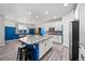 Spacious eat-in kitchen featuring a large island, modern appliances, and ample counter space at 14632 Longhorn Dr, Mead, CO 80542