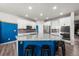 Stylish kitchen island with granite countertops, barstool seating, and ample cabinet space at 14632 Longhorn Dr, Mead, CO 80542