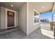 Inviting front porch with stone pillars, overhead lighting, and a welcoming 'Home Sweet Home' doormat at 14632 Longhorn Dr, Mead, CO 80542