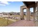 View from balcony of a modern home overlooking a green space and neighboring townhomes at 10051 Belvedere Cir, Lone Tree, CO 80124