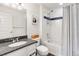 Comfortable bathroom featuring a vanity, shower and tub with curtain at 10051 Belvedere Cir, Lone Tree, CO 80124