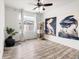 Bright bedroom with wood floors, natural light, and modern decor at 10051 Belvedere Cir, Lone Tree, CO 80124