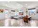 Bright living room with modern finishes, hardwood floors, large windows, and stylish decor for comfortable living at 10051 Belvedere Cir, Lone Tree, CO 80124