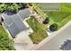 Aerial view of the home with a side walkway with shed access and a custom patio and garden to the backyard at 10869 W 65Th Way, Arvada, CO 80004