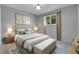 Serene bedroom featuring a luxurious upholstered bed, soft lighting, and stylish decor at 10869 W 65Th Way, Arvada, CO 80004