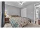 Inviting bedroom showcasing a ceiling fan, window, and comfortable bedding at 10869 W 65Th Way, Arvada, CO 80004