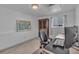 This bedroom has neutral walls, a window with blinds, and a desk with a computer at 10869 W 65Th Way, Arvada, CO 80004