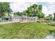 Charming home featuring a well-manicured lawn and a partial view of the inviting garden in the front yard at 10869 W 65Th Way, Arvada, CO 80004