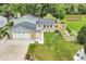 Charming home with a two-car garage, beautiful lawn, and an adjacent path, inviting outdoor adventures at 10869 W 65Th Way, Arvada, CO 80004